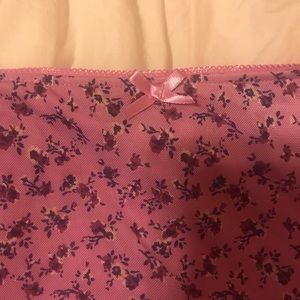 Purple Wild Fable mini skirt with a ruffled hem and flower design, size small